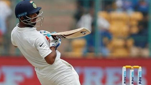 India cricket team’s Cheteshwar Pujara played a fighting knock to help the hosts take control of the second Test against Australia cricket team at M Chinnaswamy Stadium in Bangalore on Monday. He remained unbeaten on 79 as India scored 213/4 (a lead of 126 runs) at stumps on Day 3. Earlier, Ravindra Jadeja took six wickets as India bowled out Australia for 276 in the first innings. (Reuters)