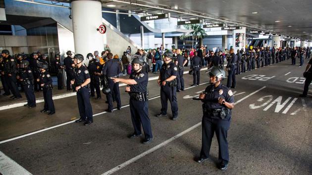 Los Angeles Airport police guard a protest against the executive order by US President Donald Trump, banning immigrants from seven majority-Muslim countries at Los Angeles International Airport in Los Angeles, California, February 4. (AFP File Photo) Los Angeles Airport police guard a protest against the executive order by US President Donald Trump, banning immigrants from seven majority-Muslim countries at Los Angeles International Airport in Los Angeles, California, February 4. (AFP File Photo)