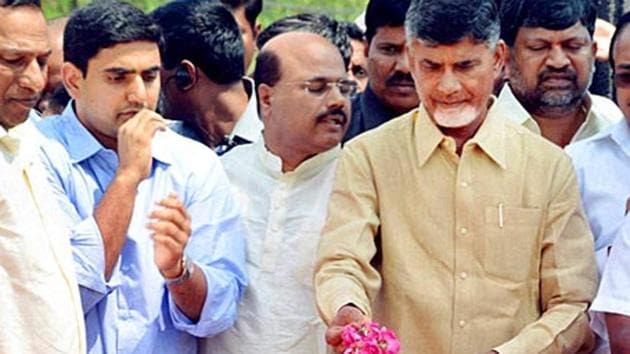Andhra Pradesh chief minister N Chandrababu Naidu (second from right) with his son Nara Lokesh (left; in blue) pay floral tributes to TDP founder and former chief minister NT Rama Rao.(PTI FIle Photo)