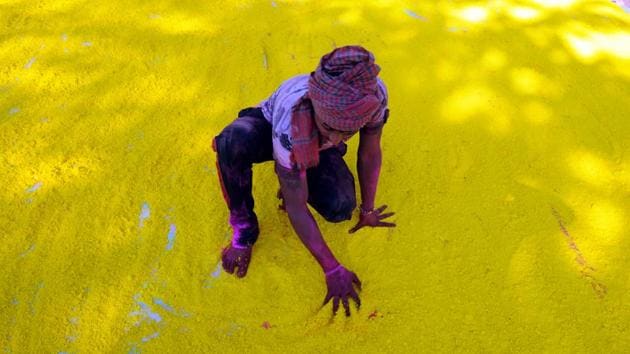 A man makes Gulal powder for use in the coming festival of Holi. (PARVEEN KUMAR/HT PHOTO) 