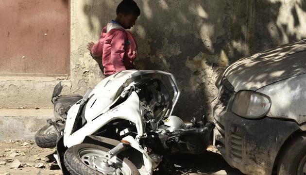 The scooter of 17-year-old Atul Arora, who died after being knocked down allegedly by a speeding Mercedes in Paschim Vihar, lay mangled on the road.(Burhaan Kinu/HT PHOTO)