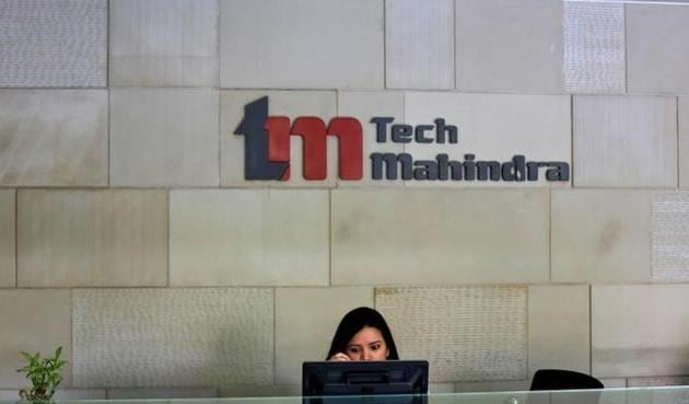 An employee sits at the front desk inside Tech Mahindra office building in Noida on the outskirts of New Delhi.(Reuters file photo)