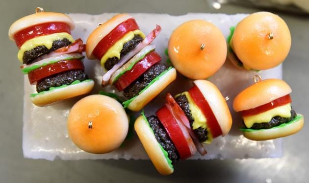 Plastic hamburger earrings made at the studio of Fake Food Hatanaka in Tokorozawa, a suburb of Tokyo. (TORU YAMANAKA / AFP) Plastic hamburger earrings made at the studio of Fake Food Hatanaka in Tokorozawa, a suburb of Tokyo. (TORU YAMANAKA / AFP)