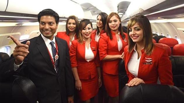Air Asia’s former CEO Mittu Chandilya with crew members after a test flight from the New Delhi airport. (HT File) Air Asia’s former CEO Mittu Chandilya with crew members after a test flight from the New Delhi airport. (HT File)