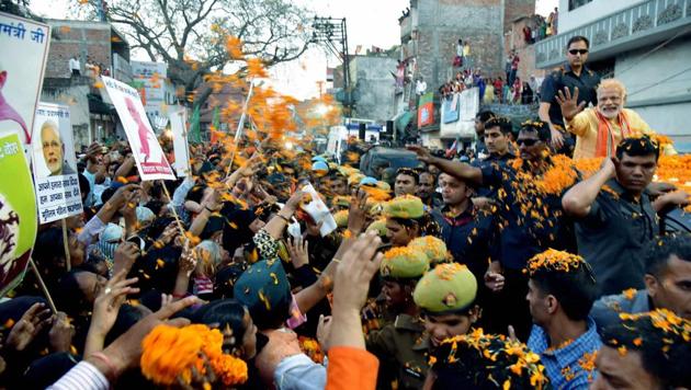 Supporters gather to see Prime Minister Narendra Modi during his road show in Varanasi on Sunday. (PTI) Supporters gather to see Prime Minister Narendra Modi during his road show in Varanasi on Sunday. (PTI)