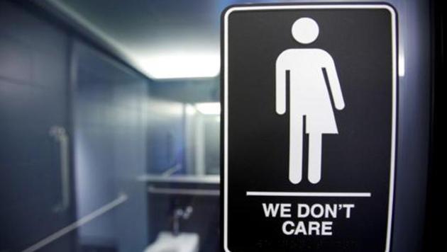 A sign protesting a recent North Carolina law restricting transgender bathroom access is seen in the bathroom stalls at the 21C Museum Hotel in Durham, North Carolina May 3, 2016.(Reuters)