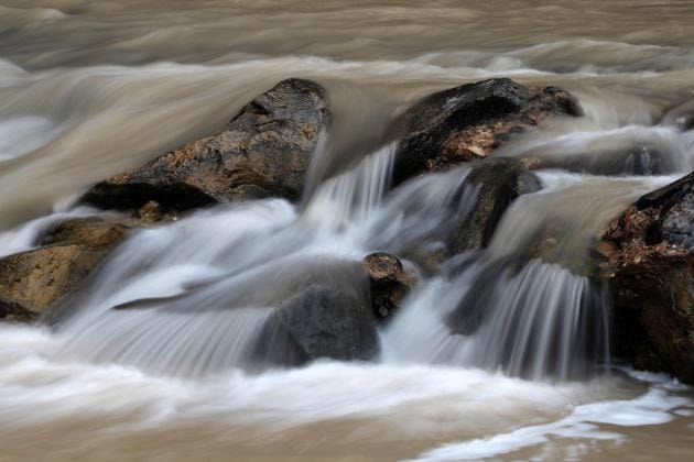 Water runs over rocks at the Riverside Walk section of Zion Canyon in Zion National Park. (RHONA WISE / AFP) Water runs over rocks at the Riverside Walk section of Zion Canyon in Zion National Park. (RHONA WISE / AFP)