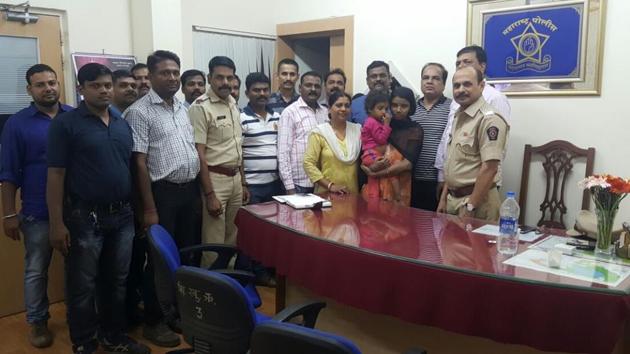 The Powai police team with the rescued child and his mother. (HT PHOTO) The Powai police team with the rescued child and his mother. (HT PHOTO)
