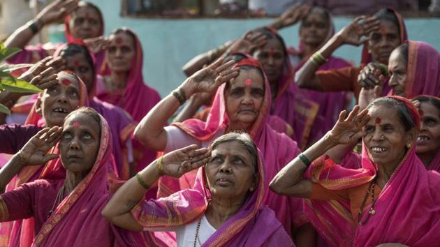 Dressed in bright pink saris, the grannies all sit together in a single classroom and learn to write, read and multiply, all in Marathi. On International Women’s Day 2017, the women will mark their one-year anniversary with celebrations. (Satish Bate/HT PHOTO)