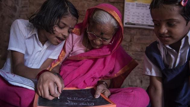 Sitabai Deshmukh, 90, is the oldest student at Aajibaichi Shala in Thane district of Maharashtra. Deprived of education as children, the women, most of whom are widows and aged between 60 and 90, are fulfilling a life-long dream to become literate through this unique initiative near Mumbai. (Satish Bate/HT PHOTO)