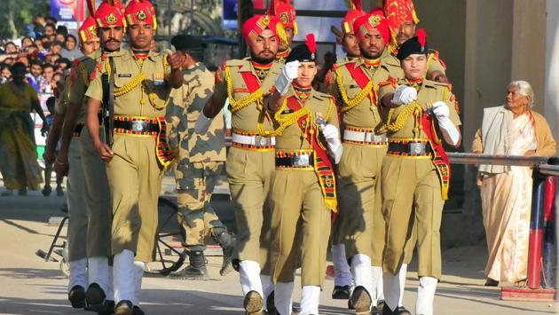 Border Security Force (BSF) constables Sagrika (right) and Manisha (left) participating in the beating retreat ceremony at Attari Border on Monday. (Sameer Sehgal/HT Photo ) Border Security Force (BSF) constables Sagrika (right) and Manisha (left) participating in the beating retreat ceremony at Attari Border on Monday. (Sameer Sehgal/HT Photo )