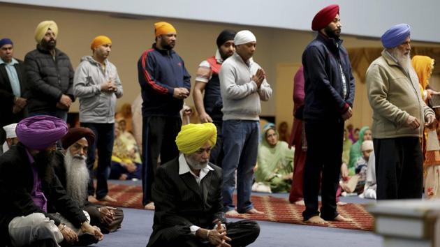 People attend services at Gurudwara Singh Sabha in Renton, Washington in south of Seattle. A Sikh man was shot by a gunman in his arm and told him "go back to your own country”, on March 3 . (AP Photo) People attend services at Gurudwara Singh Sabha in Renton, Washington in south of Seattle. A Sikh man was shot by a gunman in his arm and told him "go back to your own country”, on March 3 . (AP Photo)