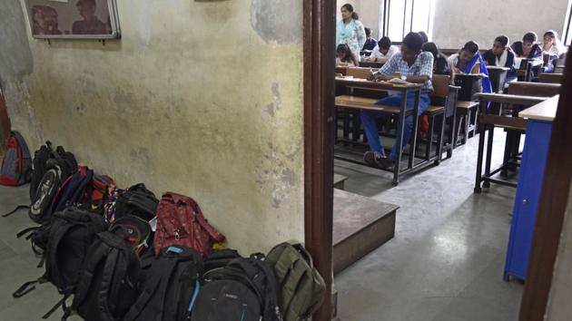 Question papers are handed out at 10: 50 am at exam centres. At an exam in Dharavi, student appear for the SSC exam. (Vijayanand Gupta/HT Photo)
