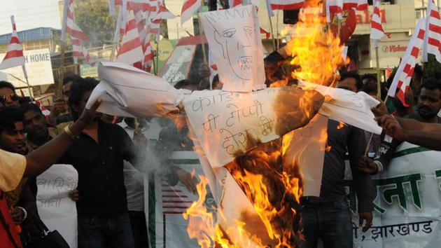Protesters under the banner of Kendriya Sarna Samiti burning an effigy of Cardinal Telesphore P Toppo on Monday in protest against his recent meeting with state Governor Draupadi Murmu on Chotanagpur Tenancy (CNT) Act and the Santhal Pargana Tenancy (SPT) Act amendment issue. (Parwaz Khan/ HT Photo) Protesters under the banner of Kendriya Sarna Samiti burning an effigy of Cardinal Telesphore P Toppo on Monday in protest against his recent meeting with state Governor Draupadi Murmu on Chotanagpur Tenancy (CNT) Act and the Santhal Pargana Tenancy (SPT) Act amendment issue. (Parwaz Khan/ HT Photo)