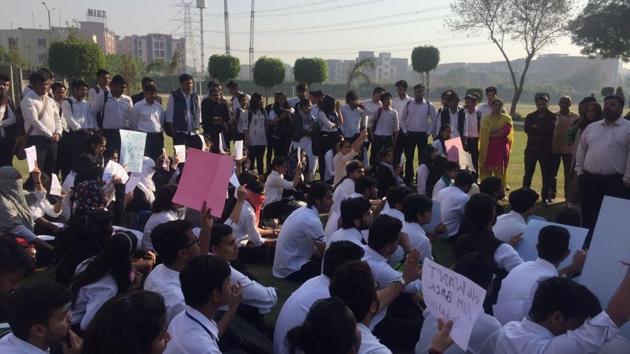 First-year students staged a sit-in on the college campus demanding the director’s reinstatement. First-year students staged a sit-in on the college campus demanding the director’s reinstatement.