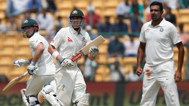 Australia's Matt Renshaw and Shaun Marsh run between the wickets as India's Ravichandran Ashwin (R) looks on. (REUTERS)