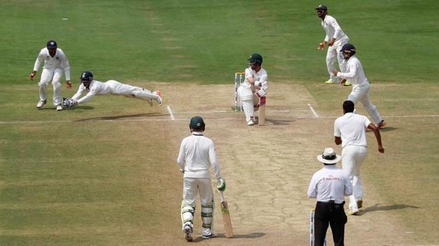 The moment of the day on the field was the acrobatic catch India cricket team wicketkeeper Wriddhiman Saha (2nd left) took to dismiss Australia cricket team's Matthew Wade for a duck. (REUTERS) The moment of the day on the field was the acrobatic catch India cricket team wicketkeeper Wriddhiman Saha (2nd left) took to dismiss Australia cricket team's Matthew Wade for a duck. (REUTERS)