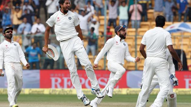 India cricket team captain Virat Kohli and players celebrate after taking the final Australian wicket on Day 4 of the second Test at M Chinnaswamy Stadium on Tuesday. Riding on half centuries from KL Rahul, Ajinkya Rahane, and a patient 92 by Cheteshwar Pujara, India set a victory target of 188 for the Aussies and bowled them out, winning by 75 runs after Ravichandran Ashwin (6-41), Umesh Yadav (2-30) ripped through the batting line-up. (REUTERS) India cricket team captain Virat Kohli and players celebrate after taking the final Australian wicket on Day 4 of the second Test at M Chinnaswamy Stadium on Tuesday. Riding on half centuries from KL Rahul, Ajinkya Rahane, and a patient 92 by Cheteshwar Pujara, India set a victory target of 188 for the Aussies and bowled them out, winning by 75 runs after Ravichandran Ashwin (6-41), Umesh Yadav (2-30) ripped through the batting line-up. (REUTERS)