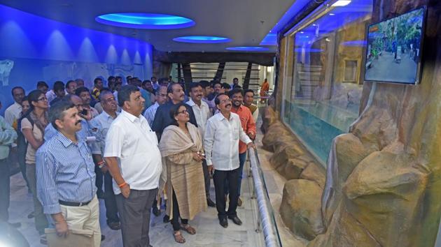 Standing committee members inspect the new penguin enclosure at Byculla zoo in Mumbai.(Pratik Chorge/HT)