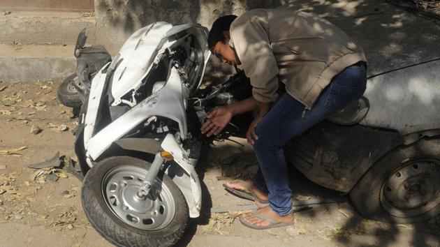 The mangled remains of the scooter after the accident which killed 17-year-old Atul Arora in the Paschim Vihar area of Delhi on Sunday(Burhaan Kinu/HT PHOTO)