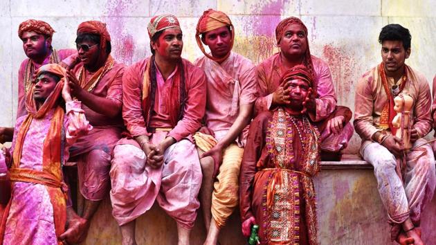 People of Nandgaon rest after participating in the celebrations. (Ajay Aggarwal/HT PHOTO)
