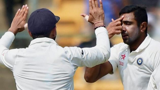 R avichandran Ashwin gestures after taking the wicket of Mitchell Starc on Day 4 of the second India vs Australia Test in Bangalore on Tuesday.(PTI)