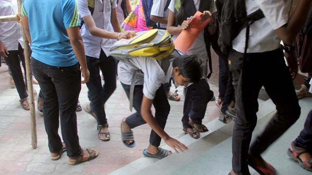 A student enters an examination hall at N M Joshi School, Lower Parel. During SSC and HSC exams, students are expected to gather in the exam rooms by 10. 30 am (Bhushan Koyande/ht photo)