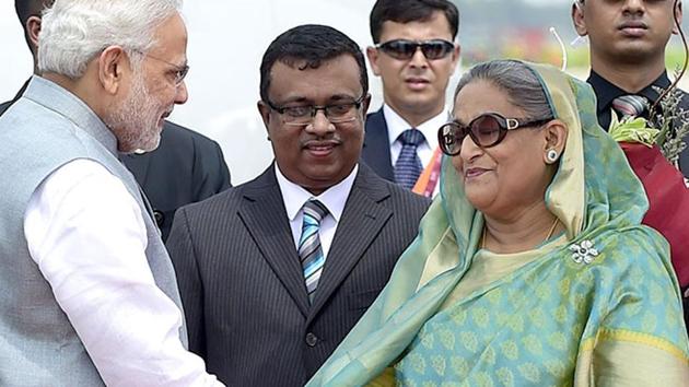 File photo of Indian Prime Minister Narendra Modi being received by his Bangladeshi counterpart, Sheikh Hasina Wajid, at the Hazrat Shahjalal International Airport in Dhaka. (AFP File) File photo of Indian Prime Minister Narendra Modi being received by his Bangladeshi counterpart, Sheikh Hasina Wajid, at the Hazrat Shahjalal International Airport in Dhaka. (AFP File)