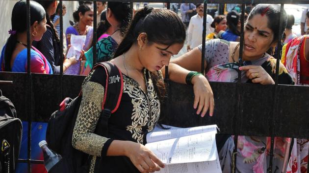 Parents come to drop students on the first day of SSC exams at an exam centre in Thane. (Praful Gangurde/HT Photo)