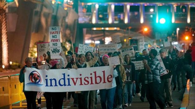 Protesters at a rally against US President Donald Trump’s new travel ban at San Diego international airport in California on March 6, 2017. Trump signed the revised ban on refugees and travellers from six Muslim-majority countries, scaling back the order to exempt Iraqis and permanent US residents.(AFP) Protesters at a rally against US President Donald Trump’s new travel ban at San Diego international airport in California on March 6, 2017. Trump signed the revised ban on refugees and travellers from six Muslim-majority countries, scaling back the order to exempt Iraqis and permanent US residents.(AFP)
