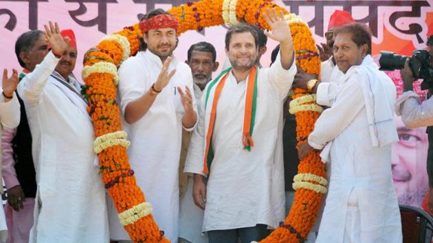 Congress vice-president Rahul Gandhi garlanded by party members at an election rally in Mirzapur on Sunday. (PTI) Congress vice-president Rahul Gandhi garlanded by party members at an election rally in Mirzapur on Sunday. (PTI)
