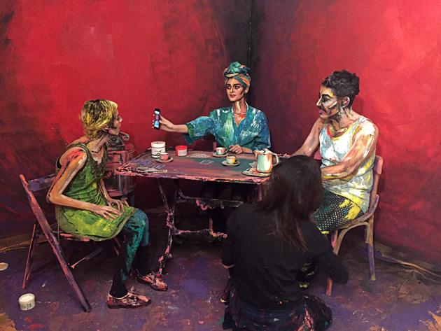 Cairo-based artist Chanel Arif's paints for her art project called After Dinner that uses humans and their surroundings as her canvas, in her gallery in the capital of Cairo. (Sherif Fahmy / REUTERS) Cairo-based artist Chanel Arif's paints for her art project called After Dinner that uses humans and their surroundings as her canvas, in her gallery in the capital of Cairo. (Sherif Fahmy / REUTERS)