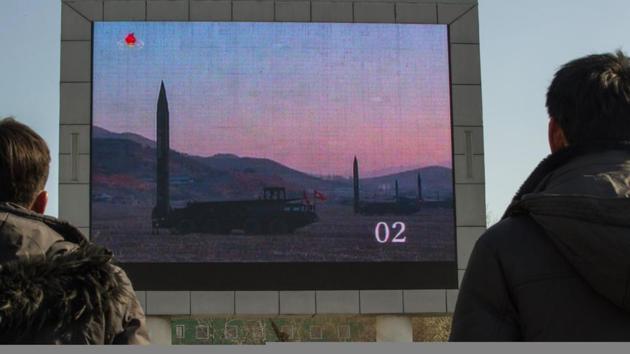 People watch news footage of a missile launch on a giant television screen outside the main railway station in Pyongyang on March 7, 2017. (AFP Photo) People watch news footage of a missile launch on a giant television screen outside the main railway station in Pyongyang on March 7, 2017. (AFP Photo)