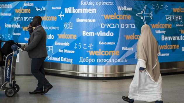 Travellers arrive at the international terminal at John F Kennedy International Airport, in New York City. President Donald Trump signed a new executive order that will ban travellers from six majority-Muslim nations from entering the United States for 90 days. (AFP Photo) Travellers arrive at the international terminal at John F Kennedy International Airport, in New York City. President Donald Trump signed a new executive order that will ban travellers from six majority-Muslim nations from entering the United States for 90 days. (AFP Photo)