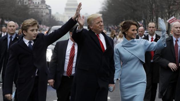 President Donald Trump waves as he walks with first lady Melania Trump and their son Barron during the inauguration parade on Pennsylvania Avenue in Washington. (AP File Photo) President Donald Trump waves as he walks with first lady Melania Trump and their son Barron during the inauguration parade on Pennsylvania Avenue in Washington. (AP File Photo)