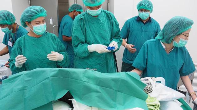 Veterinarians in Bangkok operated on the 25-year-old female green sea turtle who had been inadvertently fed a diet of coins by luck-seeking tourists. . (REUTERS)