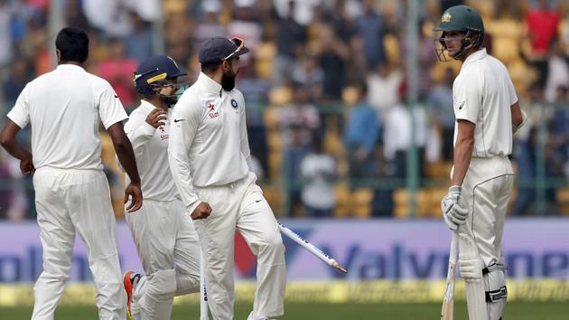 India captain Virat Kohli gestures to Australia's Josh Hazlewood after India won the second Test against Australia.(AP)