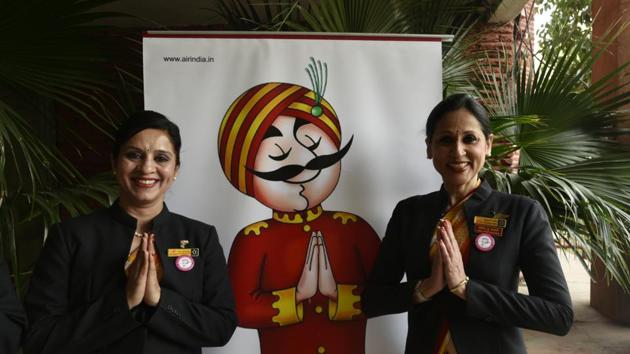 Cabin Crew of Air India, pose for a photograph celebrating the event after they recorded the historic milestone. (Vipin Kumar/HT PHOTO)