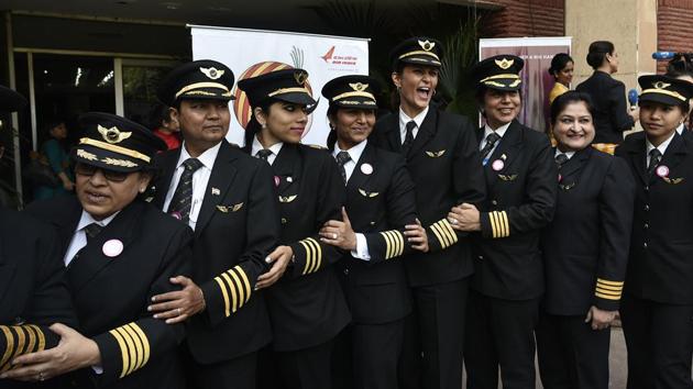 Air India women pilots pose for photographs on the eve of International Women's Day. (Vipin Kumar/HT PHOTO)