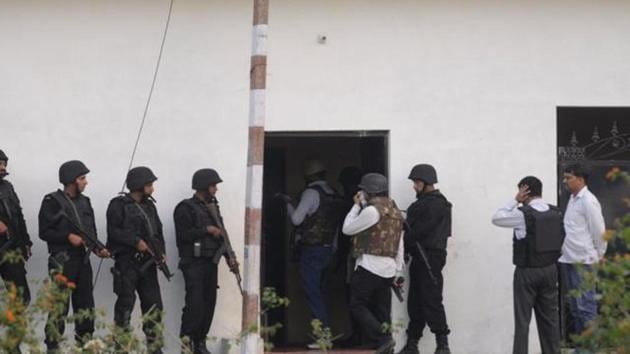 A huge cache of arms and ammunition, besides an IS flag and literature related to the outfit, were recovered from the room where Saifullah alias Saiful, 23, was gunned down in Lucknow’s Kakori area late on Tuesday night.(HT Photo/Deepak Gupta)