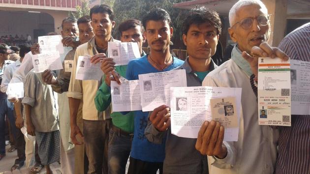 Voters stand in a queue at a polling booth in Ramapura in the seventh and last phase of assembly election in Uttar Pradesh on Wednesday. (HT Photo) Voters stand in a queue at a polling booth in Ramapura in the seventh and last phase of assembly election in Uttar Pradesh on Wednesday. (HT Photo)