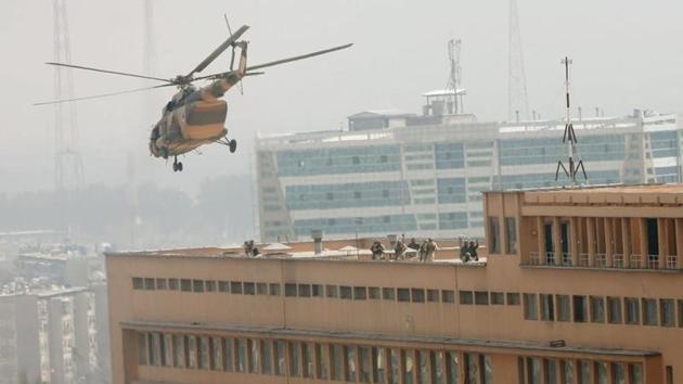 Afghan National Army soldiers descend from a helicopter on the roof of a military hospital in Kabul that was attacked by Islamic State fighters on March 8, 2017.(Reuters)