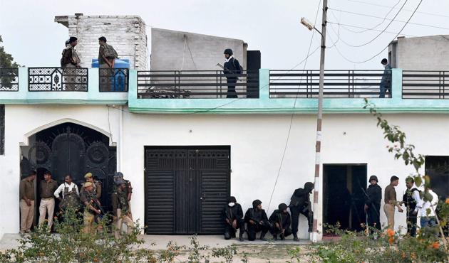 The Uttar Pradesh Anti-Terror Squad personnel take positions during an operation against a suspected terrorist in Lucknow.  The law and order situation in the state has deteriorated during the last 10 years, thanks to the patronage extended to criminals by the political class.