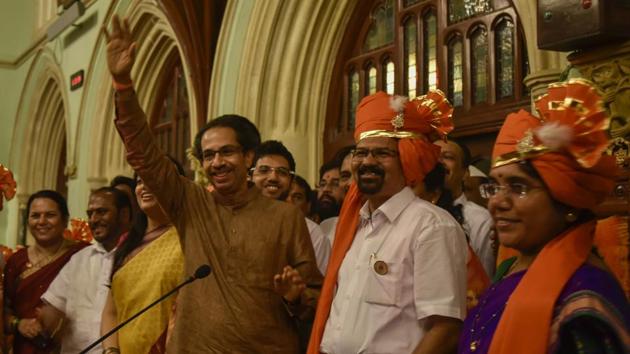 Sena president Uddhav Thackeray, with mayor Vishwanath Mahadeshwar and deputy mayor Hemangi Worlikar, addresses party workers at the BMC headquarters on Wednesday. (Kunal Patil/HT Photo)
