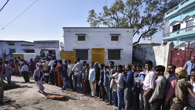 Voters line up to cast their votes at a polling station in Uttar Pradesh.(Arun Sharma/HT File Photo)