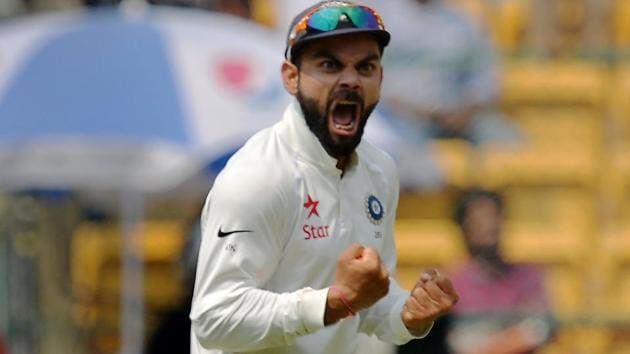 Virat Kohli celebrates after India’s victory over Australia in the second Test match in Bangalore.(AFP)