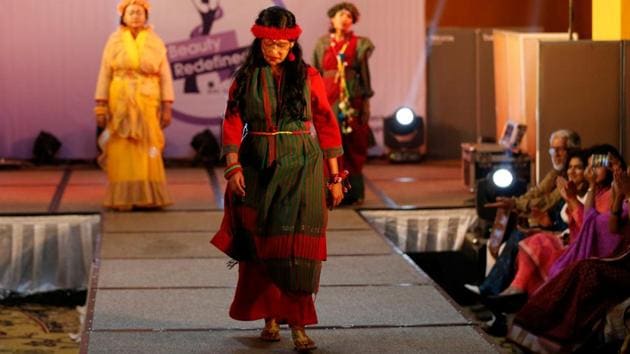 Acid attack survivors walk on the ramp during the fashion show . (Mohammad Ponir Hossain / REUTERS)
