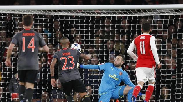 FC Bayern Munich's Chilean midfielder Arturo Vidal ( 2nd left) scores their fourth goal past Arsenal FC 's Colombian goalkeeper David Ospina during their UEFA Champions League last 16 second-leg match at The Emirates Stadium in London on Tuesday. (AFP) FC Bayern Munich's Chilean midfielder Arturo Vidal ( 2nd left) scores their fourth goal past Arsenal FC 's Colombian goalkeeper David Ospina during their UEFA Champions League last 16 second-leg match at The Emirates Stadium in London on Tuesday. (AFP)