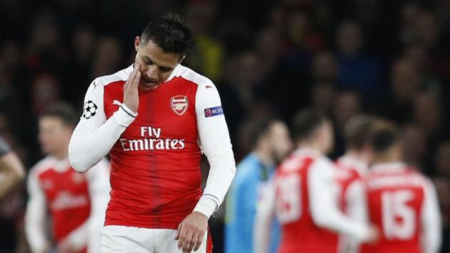 Arsenal's Alexis Sanchez (C) reacts after Bayern Munich scored their second goal during the UEFA Champions League match against Bayern Munich. (AFP) Arsenal's Alexis Sanchez (C) reacts after Bayern Munich scored their second goal during the UEFA Champions League match against Bayern Munich. (AFP)