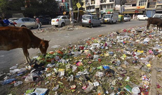 Garbage dumped on a road at Karishma Apartment, Patparganj, east Delhi. Repeated strikes by workers due to non-payment of salaries have hit sanitation in Delhi. (Virendra Singh Gosain/HT Photo) Garbage dumped on a road at Karishma Apartment, Patparganj, east Delhi. Repeated strikes by workers due to non-payment of salaries have hit sanitation in Delhi. (Virendra Singh Gosain/HT Photo)
